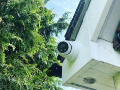 Turret camera installed on soffits of building